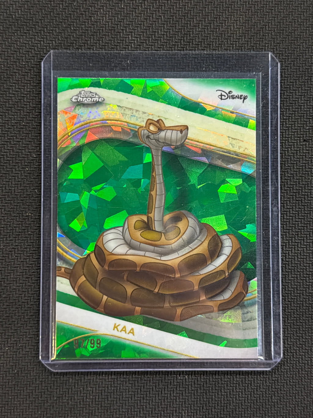 2025 Topps Chrome Disney Sapphire Kaa Green /99 Jungle Book
