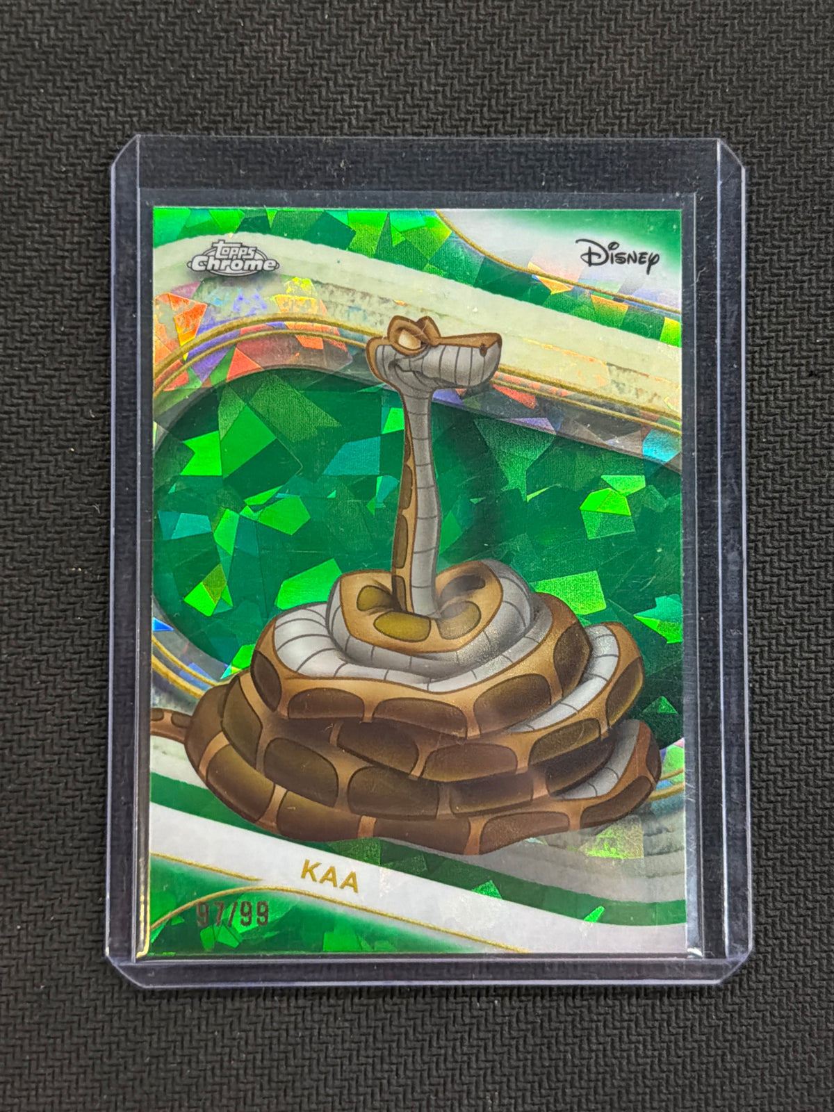 2025 Topps Chrome Disney Sapphire Kaa Green /99 Jungle Book