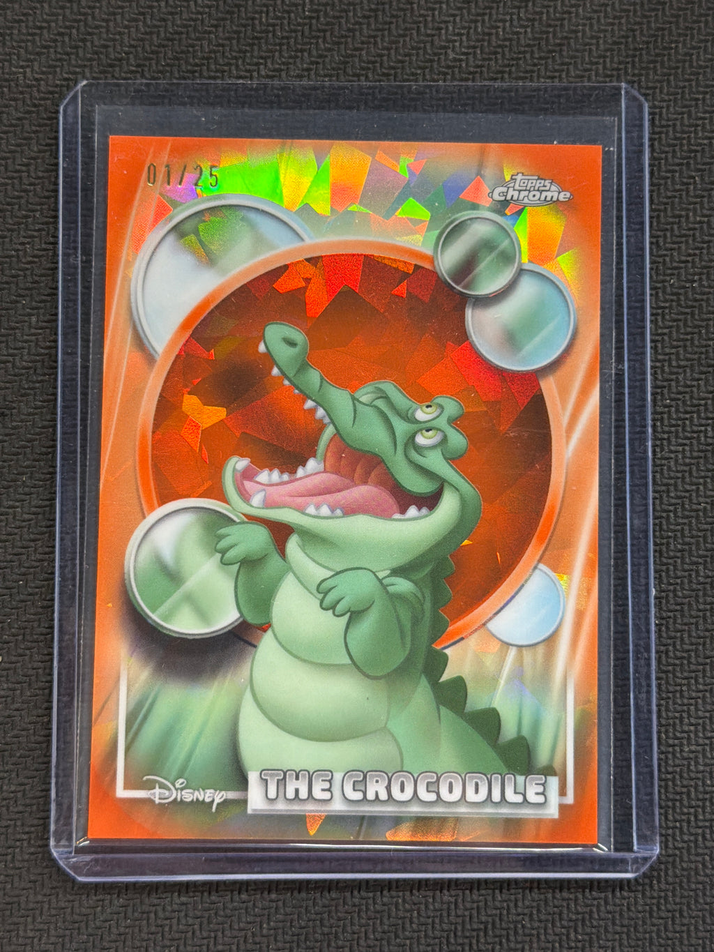2026 Topps Chrome Disney Sapphire The Crocodile Orange /25